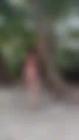 Sexy red lingerie modelling at beach