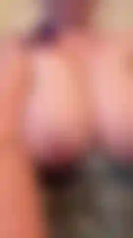 Shaking them and playing with my tits out of my dress