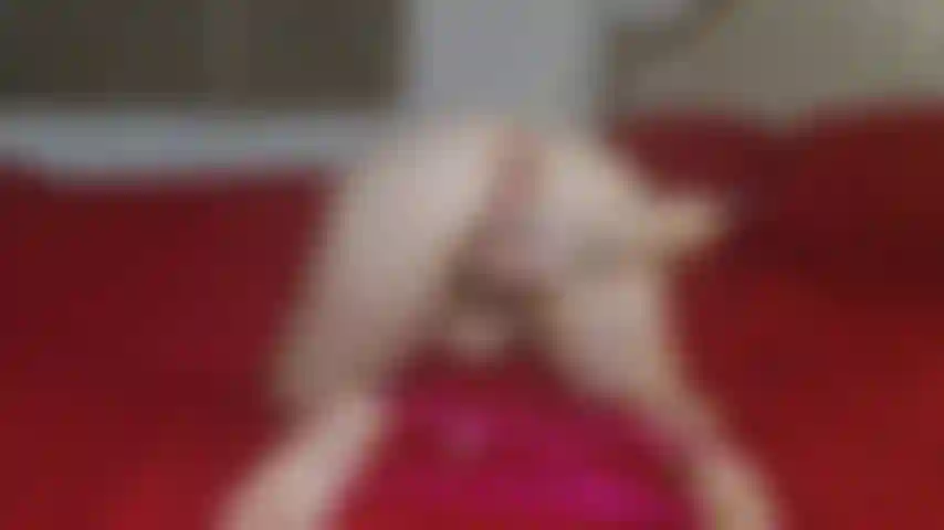 Here playing with my dildo on my new hotel bed,