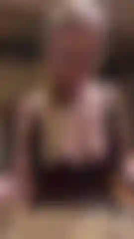 Hot blonde MILF is trying to get her hubbys attention as he is too busy watching a film. She teases him as she unzips her tight black lace mini dress. Her soft pert breasts tumble out.