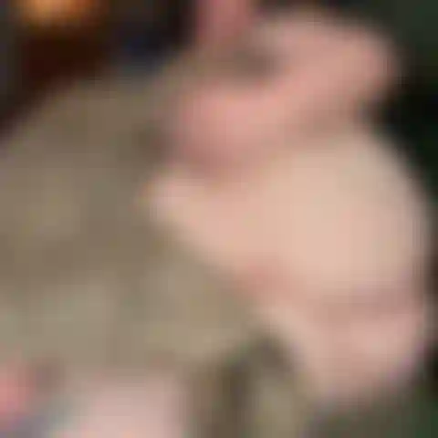 Spreading cheeks and showing asshole while on couch
