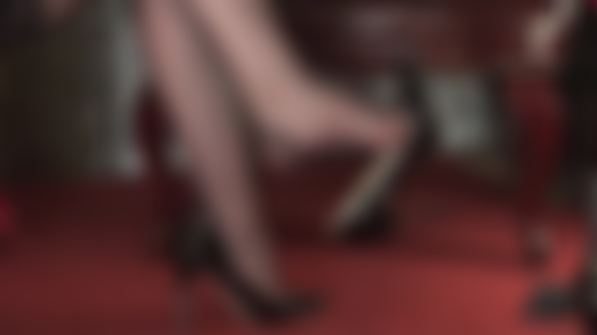 Barefoot shoe play - A gorgeous side view of Mistress Vivian's high arches in cuban stockings and bare feet dangling sexy black peeptoes pumps.