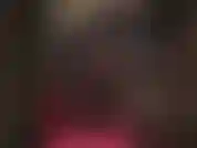 Ein wunderschöner, enger, halbtransparenter lycra-catsuit mit korsett und hohen stiefeln.