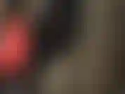 Arsch und beine im latex-catsuit.