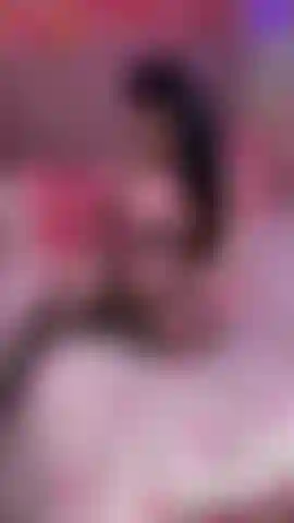 wearing pink floral lingerie set with black fishnet stockings  BTS content shoot  seductive eyes & flirty smile  caressing my curvy body  playing with my long hair