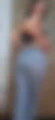 I playfully tease you as I undress and provoke you, my jeans are the first to come off my body.