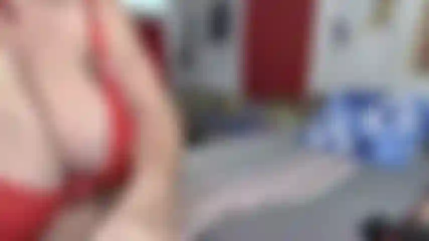 ON THE BED SDEWAYS WITH G-STRING, BRA, HEELS---TAKING BRA OFF SO TITS SWING---DIRTY TALK