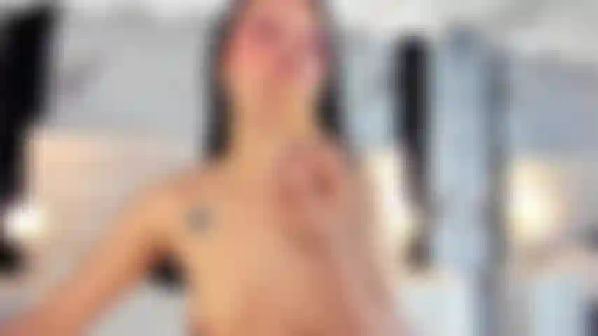 Naked, with saliva on her face and cum on her face